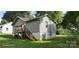 Back exterior of a home featuring a wooden deck, stairs and walk out basement at 608 E E St, Newton, NC 28658