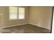 A nice bedroom featuring wood-look flooring, neutral walls and a window at 608 E E St, Newton, NC 28658