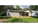 View of home's exterior with tidy landscaping and a covered front porch area at 608 E E St, Newton, NC 28658