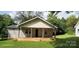 Charming single-story home with a welcoming front porch and well-maintained lawn at 608 E E St, Newton, NC 28658