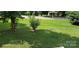 The front yard features nice landscaping and a lush green lawn at 608 E E St, Newton, NC 28658