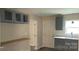 Modern kitchen design with breakfast bar and gray cabinets at 608 E E St, Newton, NC 28658
