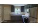 Updated kitchen featuring modern appliances, gray cabinetry and countertops at 608 E E St, Newton, NC 28658