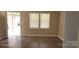 Bright living area with neutral walls, laminate flooring, and natural light at 608 E E St, Newton, NC 28658