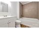 This bathroom features a tile surround and white vanity at 613 N Rhyne St, Gastonia, NC 28054
