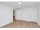 Clean and bright bedroom with modern floors, fresh paint, and two closets at 613 N Rhyne St, Gastonia, NC 28054