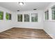 Bright bedroom featuring hardwood floors, neutral paint and lots of windows at 613 N Rhyne St, Gastonia, NC 28054