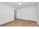 This bedroom features wood-look flooring, white walls and view to another room at 613 N Rhyne St, Gastonia, NC 28054