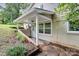 Side view of a home featuring a covered patio and crawlspace entrance at 613 N Rhyne St, Gastonia, NC 28054