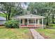 Charming home with a welcoming front porch, walkway, and lush landscaping at 613 N Rhyne St, Gastonia, NC 28054