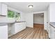 Modern kitchen with stainless steel sink, white cabinetry, and an open layout at 613 N Rhyne St, Gastonia, NC 28054