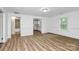 Spacious living area with open layout, modern floors, and access to kitchen and bath at 613 N Rhyne St, Gastonia, NC 28054