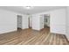 Spacious living room with wood-look floors and crown moulding throughout at 613 N Rhyne St, Gastonia, NC 28054
