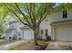 A well-maintained backyard featuring a patio and detached garage at 6518 Point Comfort Ln, Charlotte, NC 28226