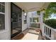 Charming front porch with a storm door, a welcome mat, and white railings at 6518 Point Comfort Ln, Charlotte, NC 28226