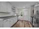 Bright kitchen with white cabinets, stainless steel appliances, and a convenient layout perfect for cooking and entertaining at 6518 Point Comfort Ln, Charlotte, NC 28226