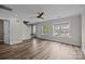 Inviting living space featuring hardwood floors, large windows, and modern finishes providing an airy atmosphere at 6518 Point Comfort Ln, Charlotte, NC 28226