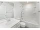 Well-lit bathroom featuring a modern vanity, tub-shower combo, and sleek fixtures for a clean aesthetic at 6726 Carradale Way, Charlotte, NC 28278