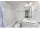 The full bathroom features shower over tub, contemporary fixtures and tiled floors at 6726 Carradale Way, Charlotte, NC 28278