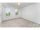 Bedroom features carpet, natural light, and neutral walls at 6726 Carradale Way, Charlotte, NC 28278