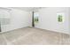 This bedroom features neutral carpet and large windows at 6726 Carradale Way, Charlotte, NC 28278