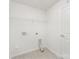 The laundry room is equipped with tile floors and shelving at 6726 Carradale Way, Charlotte, NC 28278