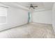 This spacious main bedroom features a tray ceiling, carpet and neutral walls at 6726 Carradale Way, Charlotte, NC 28278