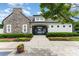 Pool gate entry with stone and siding details, surrounded by beautiful landscaping at 6726 Carradale Way, Charlotte, NC 28278