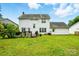 A beautifully landscaped backyard featuring an elevated wood deck perfect for entertaining at 6821 Millingden Ct, Charlotte, NC 28277