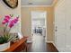 Welcoming foyer with neutral walls and hardwood floors looking toward the breakfast nook at 6821 Millingden Ct, Charlotte, NC 28277