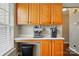 Kitchen nook with countertops, wooden cabinets, under cabinet lighting, and a coffee bar area at 6821 Millingden Ct, Charlotte, NC 28277