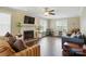 Spacious living room featuring a brick fireplace, hardwood floors, and modern furnishings at 6821 Millingden Ct, Charlotte, NC 28277