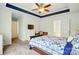 Bright bedroom with ceiling trim, a desk, and a ensuite bathroom entrance at 6821 Millingden Ct, Charlotte, NC 28277