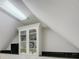 Finished attic space with built-in cabinets and shelving, offering ample storage at 736 Creekbridge Dr, Rock Hill, SC 29732