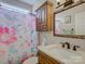 Bathroom featuring a granite vanity, floral shower curtain, and wood cabinet at 736 Creekbridge Dr, Rock Hill, SC 29732