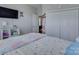 Bright bedroom features a large bed, closet, and hardwood flooring at 736 Creekbridge Dr, Rock Hill, SC 29732