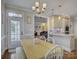 Bright breakfast nook adjacent to the kitchen, featuring a wooden table and a bench at 736 Creekbridge Dr, Rock Hill, SC 29732