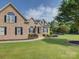 Beautiful brick home featuring a manicured lawn, landscaping, and a walkway leading to the entrance at 736 Creekbridge Dr, Rock Hill, SC 29732