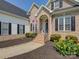 Inviting home featuring a brick facade, manicured landscaping, and a welcoming front entrance at 736 Creekbridge Dr, Rock Hill, SC 29732