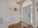 Bright foyer with hardwood floors, neutral walls, elegant lighting, and a welcoming front door at 736 Creekbridge Dr, Rock Hill, SC 29732