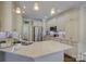 Modern kitchen featuring white cabinets, stainless steel appliances, and a spacious island at 736 Creekbridge Dr, Rock Hill, SC 29732