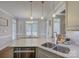 Modern kitchen island featuring stainless steel appliances, marble countertops, and pendant lighting at 736 Creekbridge Dr, Rock Hill, SC 29732