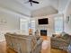 Spacious living room with a vaulted ceiling, fireplace, and large windows offering plenty of natural light at 736 Creekbridge Dr, Rock Hill, SC 29732