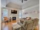 Comfortable living room featuring hardwood floors, a fireplace, and vaulted ceiling with a ceiling fan at 736 Creekbridge Dr, Rock Hill, SC 29732