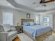 Main bedroom featuring a ceiling fan, carpet, and a glimpse into the ensuite bathroom at 736 Creekbridge Dr, Rock Hill, SC 29732