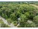 Aerial view of the home showing the roof, backyard, and surrounding trees at 7830 Sarah Dr, Denver, NC 28037