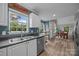 Bright kitchen with stainless steel appliances and open layout to dining area at 7830 Sarah Dr, Denver, NC 28037