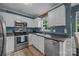 Well-lit kitchen with stainless steel appliances and functional layout for easy cooking at 7830 Sarah Dr, Denver, NC 28037