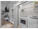 Convenient laundry room with washer, dryer, and storage shelves for supplies at 7830 Sarah Dr, Denver, NC 28037