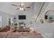 Bright and airy living room featuring a comfortable sectional couch and tall ceilings at 7830 Sarah Dr, Denver, NC 28037